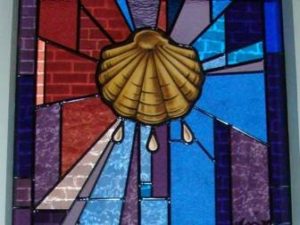 Symbol: Shell, as a symbol for mission, the spreading the word of God. Corner: Light