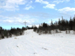 The toboggan hill at Crieff Hills Retreat Centre in Winter. A person riding skis down a snow covered slope