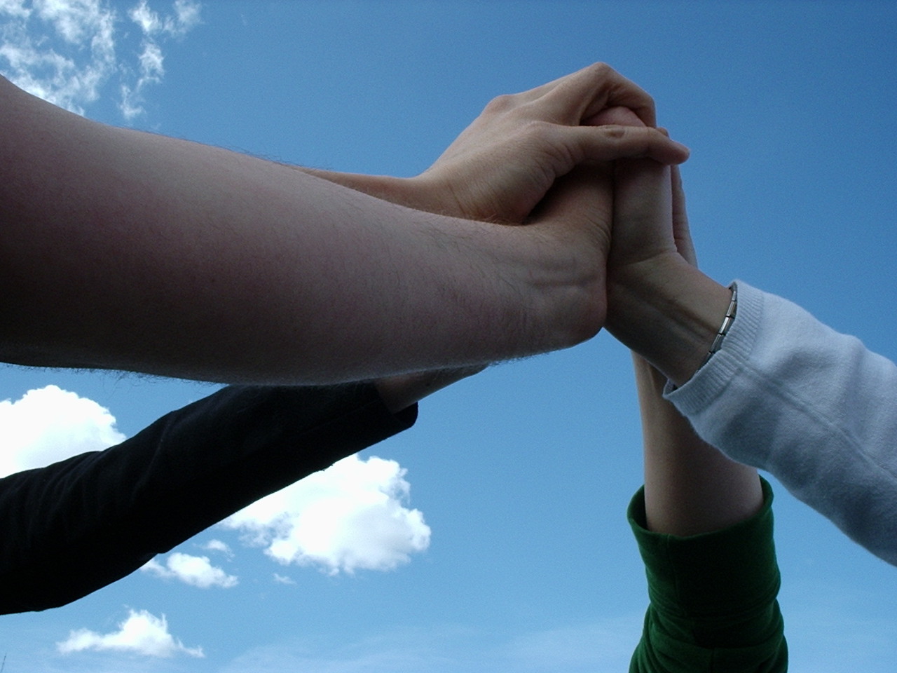 Our four Vicars with four hands together